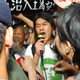 Wearing his trademark Che Guevara t-shirt, Hong Kong activist "Longhair" Leung Kwok-hung shouts into a bullhorn during a protest in Hong Kong, July 1, 2004. The veteran gadfly is now hoping to take his message inside the halls of power by running for a legislative seat. Leung, who fell about 7,700 votes short in the last legislative election four years ago, believes massive anti-government sentiment will carry him to victory in the Sept. 12 contest.